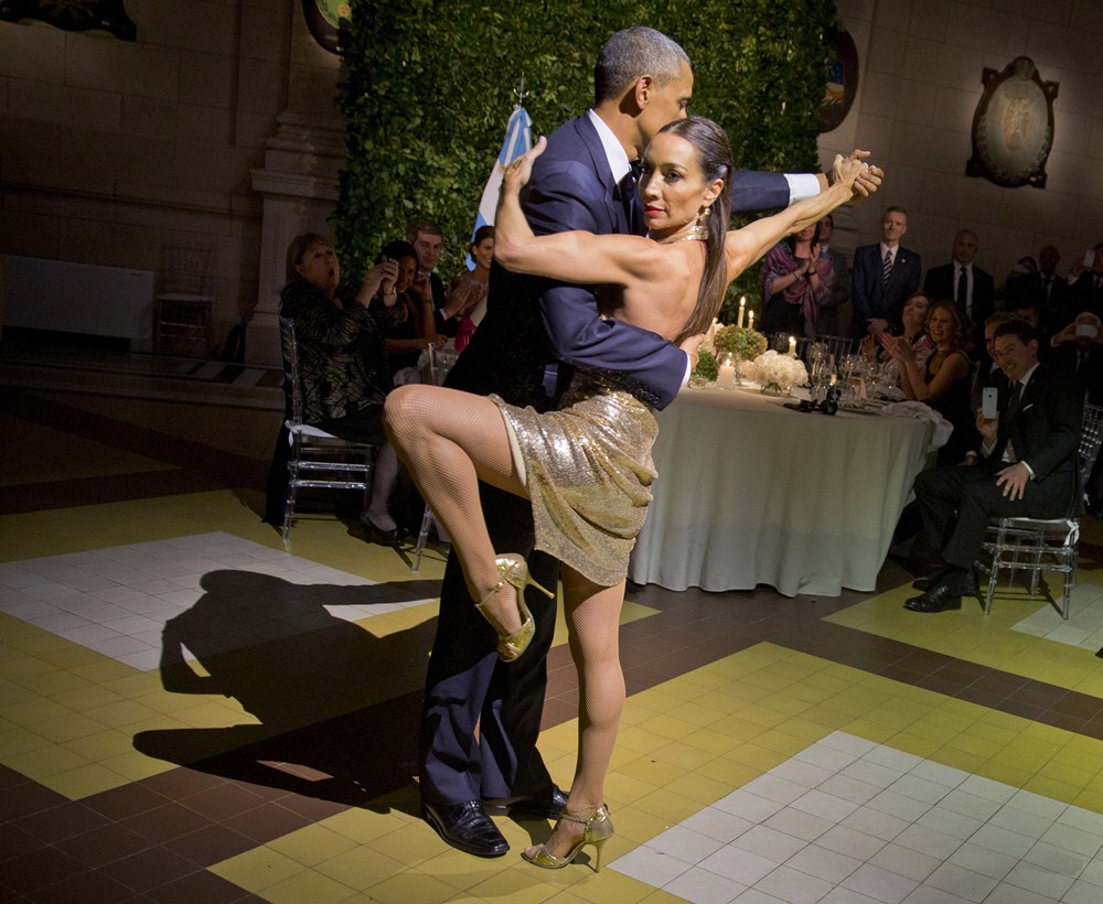 President Barack Obama with does the tango with a dancer during the State Dinner at the Centro Cultural Kirchner, Wednesday, March 23, 2016, in Buenos Aires, Argentina. (AP Photo/Pablo Martinez Monsivais)