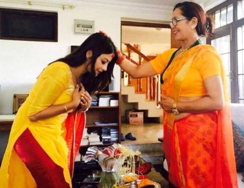Shweta Khadka giving Dashain's Teeka & Jamara by her Dance Teacher Laxmi Shrestha