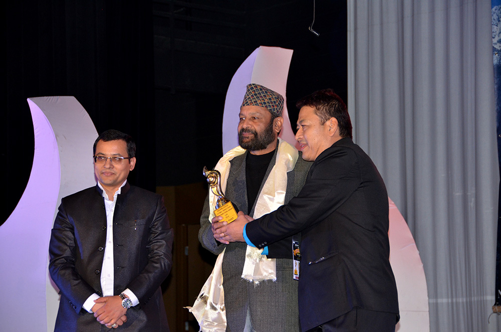 Vetran Actor R.P. Panta receiving Global Nepali Film Award 2016