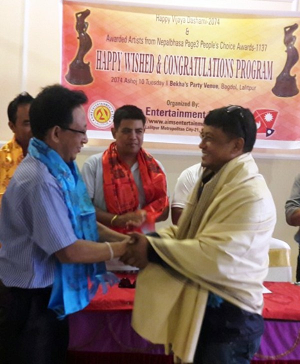 Shyam Smrit awarded Special Journalism Award. Award give hand over by Fist Nepal Bhasha Journalist Bijay Ratna Asabare.